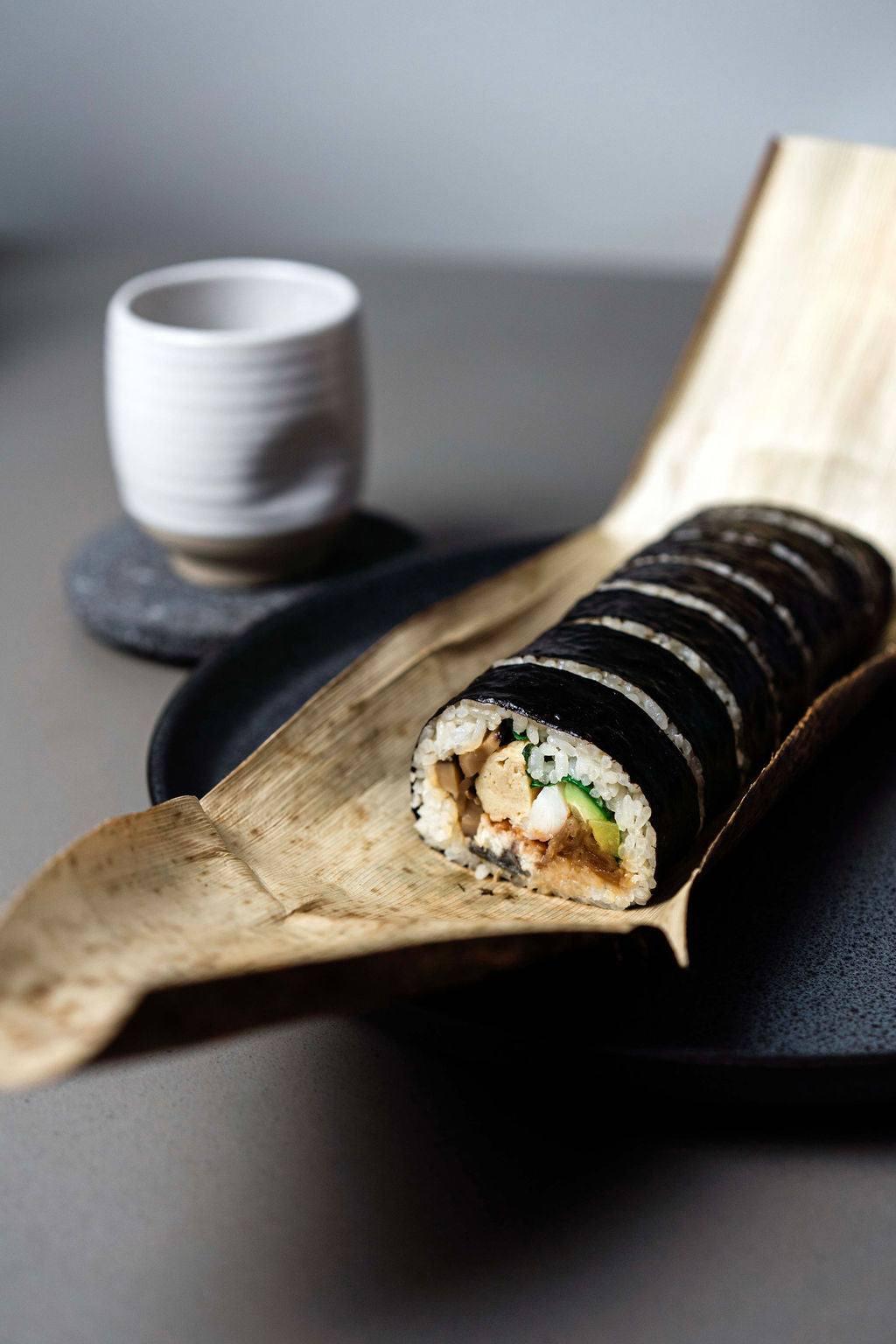 Kinkan Futomaki sliced on bamboo leaf