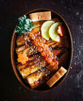 Japanese Unagi Don with Jidori egg tamagoyaki, Japanese pickles, sesame, and optional ikura